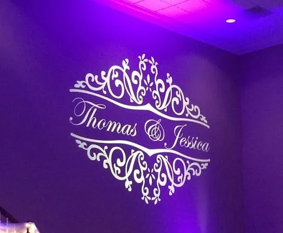 Custom Thomas & Jessica monogram projected on a venue wall